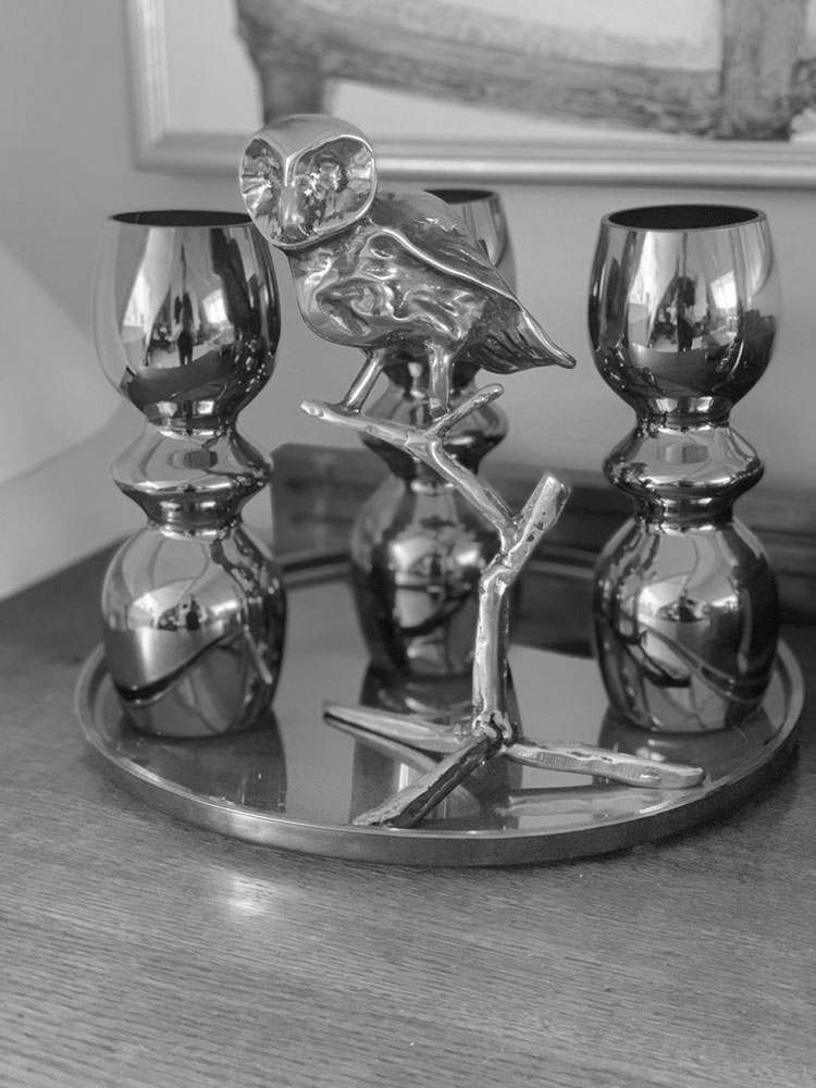 Statue of owl with objects to represent B2B business Statue of owl with objects to represent B2B business